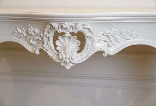 Carved decorative pattern on a white table &ndash; art in every detail
