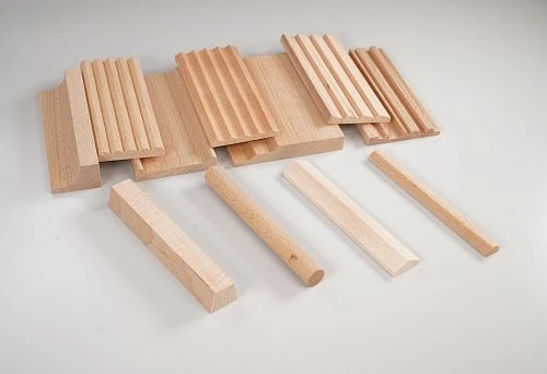 Various options of wooden rails with different cross-sections and shapes