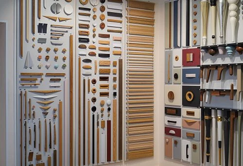 Exhibition stand featuring diverse wooden samples and decorative elements of various shapes and shades.