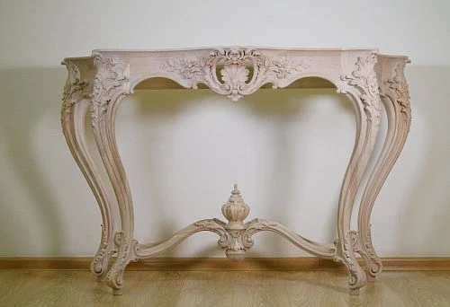 Designer console with curved legs and carved pattern