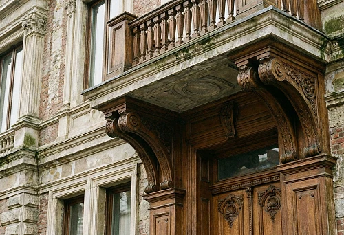 Premium facade: polyurethane facade stucco with cement coating and carved wooden portal
