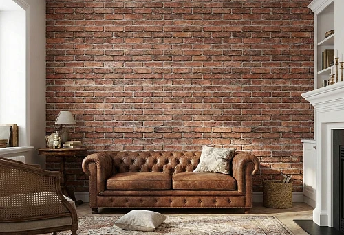 Polyurethane brick imitation: decorative masonry on a living room wall with a leather sofa