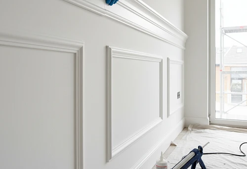 Process of installing polyurethane molding on a wall using sealant