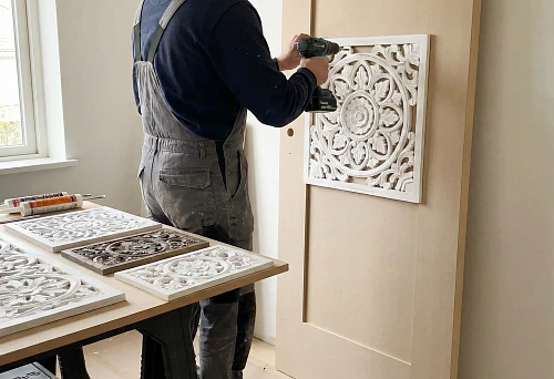 Installing a decorative overlay on an interior door using power tools