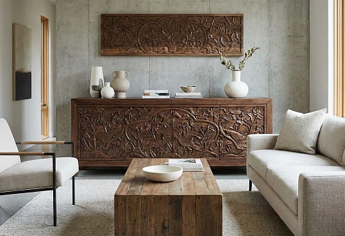 Carved decor for furniture: a wooden sideboard with hand carving in a modern interior