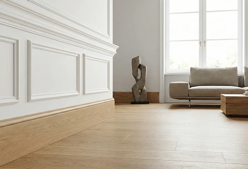 Wooden baseboards in a modern interior with minimalist furniture and polyurethane molding