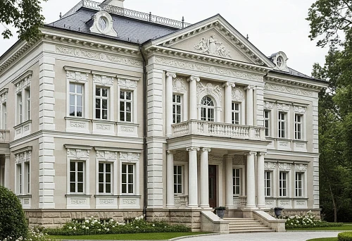 Classic house facade with facade molding, columns, and cornices