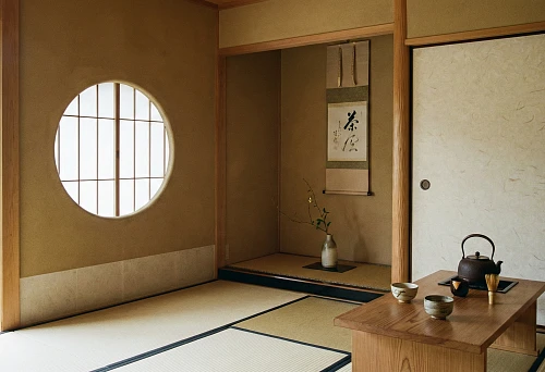 Minimalist room with wooden elements, sliding doors, and a tea table.