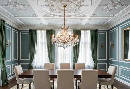 Dining Area with Designer Table and Striking Ceiling with Molding and Chandelier
