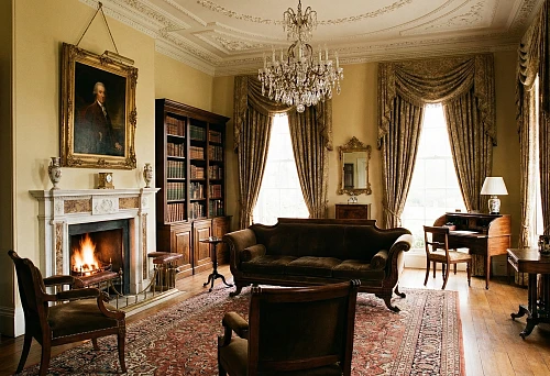 Polyurethane molding decor in a classic interior: ceiling ornaments, moldings, and cornices with expressive detailing in a bright living room.