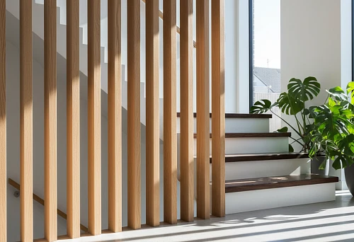 Flat wooden balusters with clear geometry along a staircase in a modern interior with panoramic windows