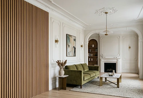 Living room interior with wooden slat panels on an accent wall and white polyurethane moldings in a classic style