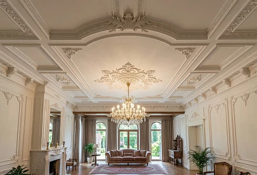 Stucco on the ceiling in a classic living room with a chandelier, decorative moldings, and elegant ceiling decor