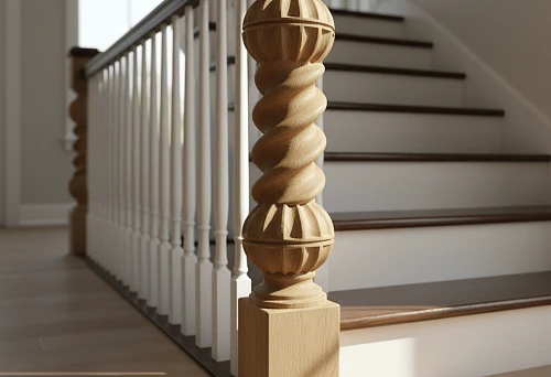 Carved wooden baluster with a twisted oak pattern on a staircase featuring white posts and dark steps