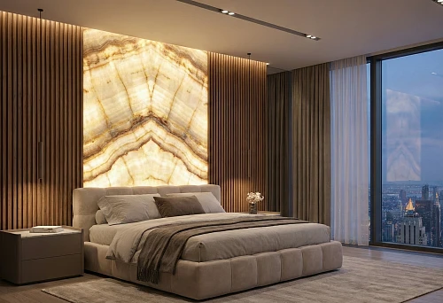 Decorative wall panels with lighting behind the headboard in a modern bedroom interior