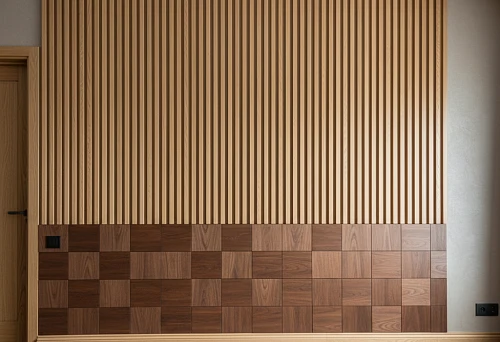 Modern interior with wooden battens and decorative panels.