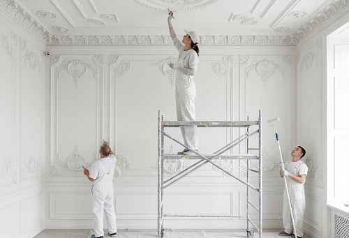 professionals paint molding on ceilings and walls