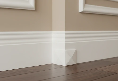 Neat baseboard corner finishing using polyurethane corner and wooden baseboard against decorative wall moldings