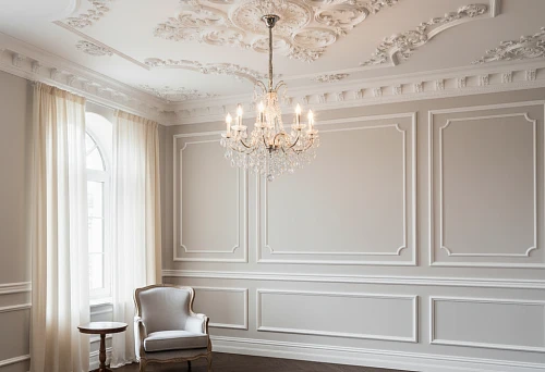 A classic interior with rich ceiling molding and a white wooden baseboard, emphasizing the elegance and harmony of the space