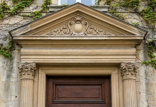 Door portal with pediment &mdash; cornice and capitals STAVROS in classic architectural facade design