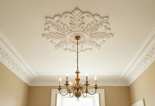 Polyurethane ceiling molding with a chandelier rosette and classic ceiling cornice