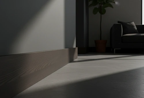 Dark solid wood floor skirting board along the wall in a modern interior, smooth abutment line and clean floor-to-wall joints