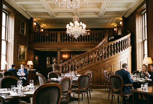 Wooden balusters for stairs in a restaurant interior &mdash; classic style, carved elements and architectural expressiveness
