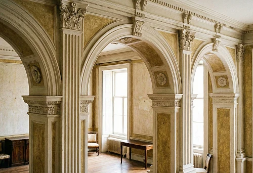Polyurethane stucco arches: decoration of arched openings with pilasters and cornice in a classic interior