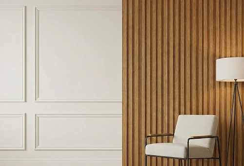 Wall with molding and fluted wall panels &mdash; white molding frames on smooth wall on the left, vertical wooden fluted panels on the right