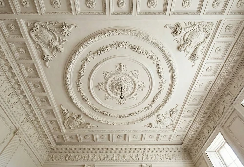 Ceiling Molding and Ceiling Decorations in a Formal Interior: Coffers Around the Perimeter, a Large Central Ceiling Rosette, and a Medallion for the Chandelier