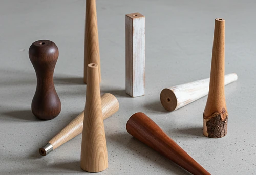 Various wooden chair legs in different shapes and shades, showcasing styles &mdash; classic, loft, Scandinavian, and minimalism