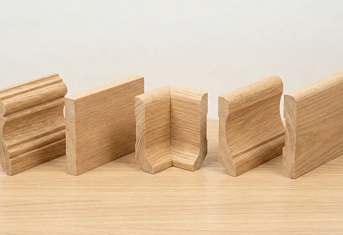Types of wooden baseboards: shaped profile made of solid wood with pronounced relief and chamfers