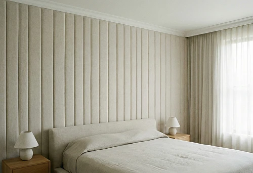 Bedroom with soft vertical wall panels and a thin white ceiling cornice