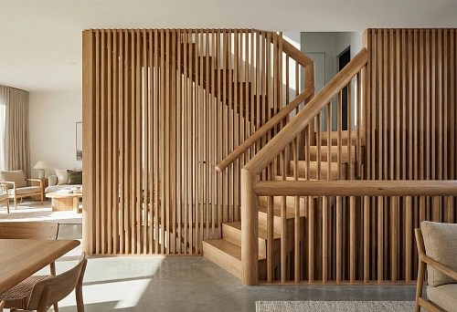 Interior with round handrails and vertical wooden slats for 2026 zoning
