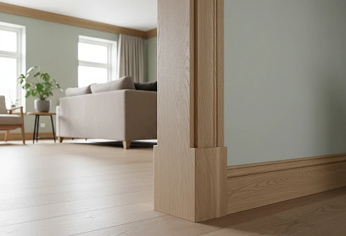 Wooden baseboards and moldings forming a neat floor interior line; light solid wood