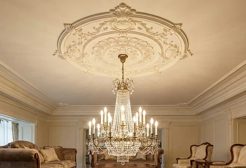 Polyurethane ceiling molding and chandelier: large ornate rosette in a formal living room