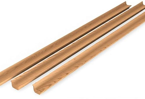 Three long wooden baseboards with rounded profile on white background