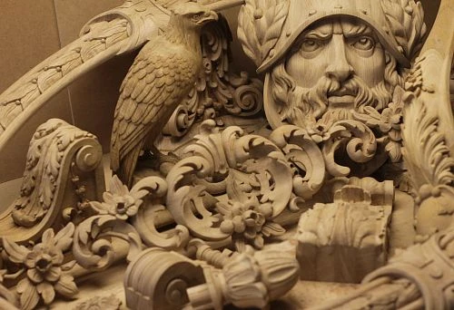 Fragment of Intricate Wood Carving: Helmeted Head, Bird Sculpture, Ornamental and Floral Motifs