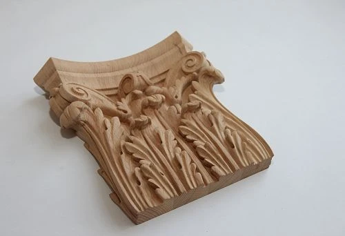 Carved wooden furniture element in classic style before restoration