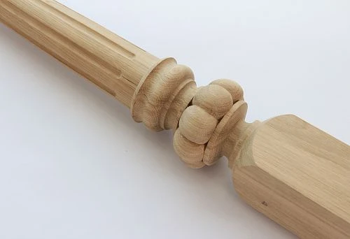 Decorative wooden baluster with carved ornament.