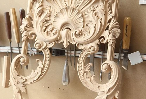 Carved decorative wood applique with classic elements
