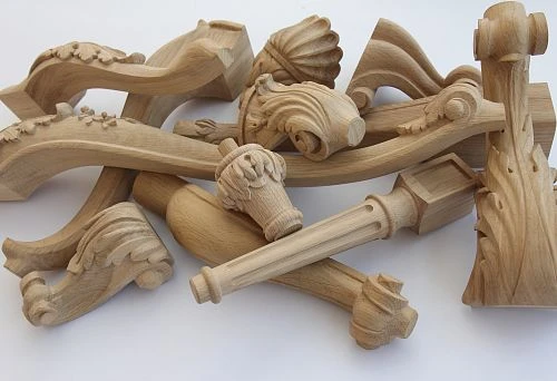 Carved wooden legs and furniture supports made of solid oak with various ornaments and shapes