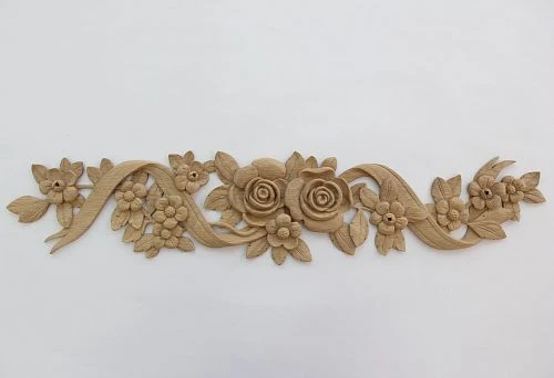 Floral carved decor in solid wood &mdash; roses, flowers, and ribbons, original carving for furniture and interior