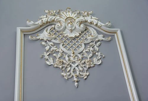 Decorative composition for wall with carved elements and moldings