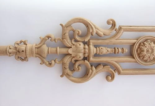 Carved wooden half-baletines with rich ornamentation and central medallion in classical style