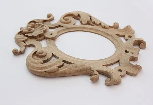 Elegant wooden frame with exquisite carved patterns and classic ornamentation.
