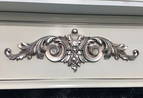 Decorative natural wood finish with carving and silver patina