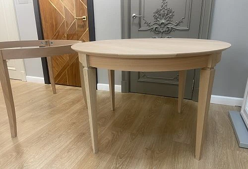 Wooden table base with elegant legs, crafted in classic style, against interior backdrop