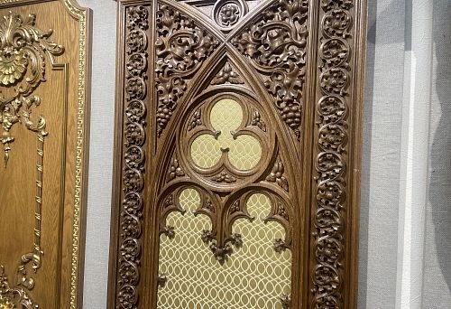 Carved wooden element with Gothic patterns, executed in a classic style with high detail.