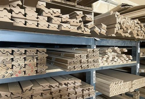 Shelf with various wooden profiles and finishing elements, folded for storage